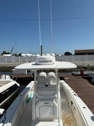  Yacht Photos Pics 2018 Jupiter 26 FS boat docked, featuring Garmin equipment and spacious seating.