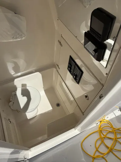  Yacht Photos Pics Interior of 2018 Jupiter 26 FS boat featuring a compact marine toilet.