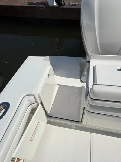  Yacht Photos Pics 2018 Jupiter 26 FS boat interior with white seating and deck, dockside view.