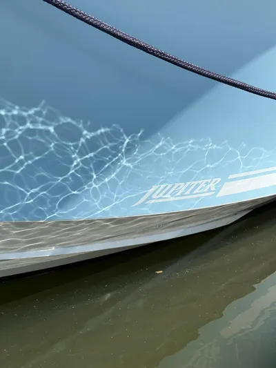  Yacht Photos Pics 2018 Jupiter 26 FS boat hull reflecting water patterns.