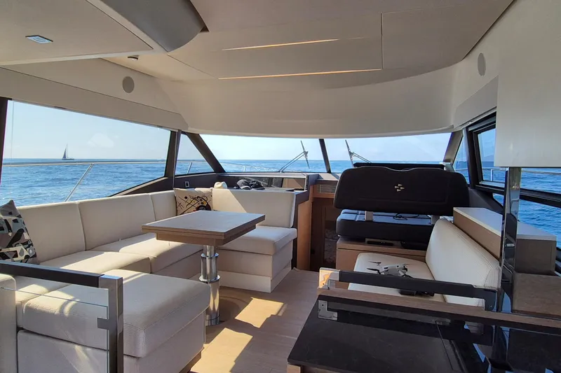  Yacht Photos Pics Luxurious interior of 2022 Prestige 460 yacht with ocean view and modern seating.