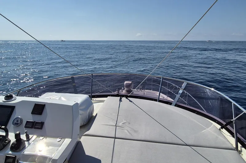  Yacht Photos Pics Prestige 460 yacht deck view, 2022 model, cruising on open sea under clear skies.