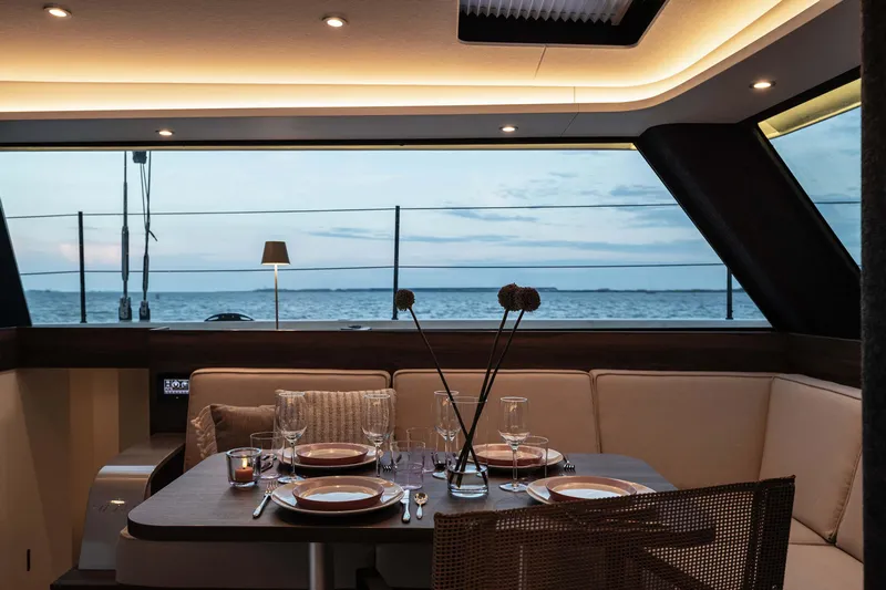  Yacht Photos Pics Luxurious dining area inside 2025 Vaan R4 yacht with ocean view.