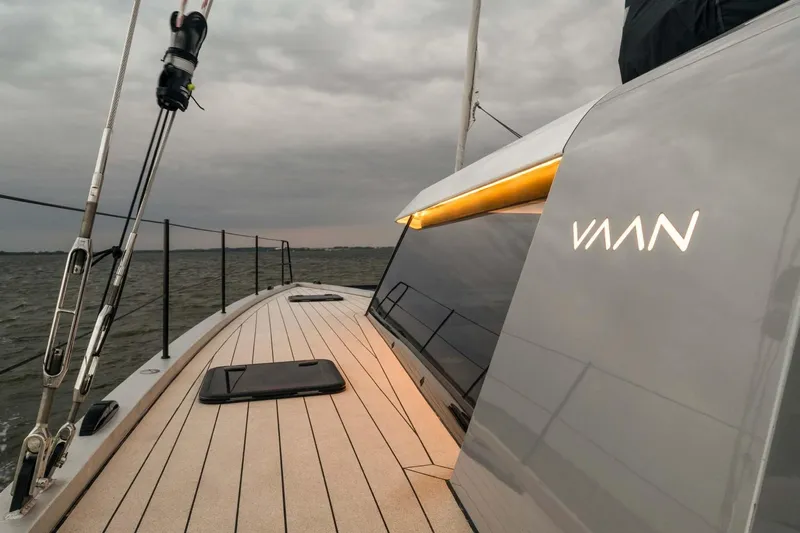  Yacht Photos Pics Sleek 2025 Vaan R4 yacht deck with modern design and overcast sky.