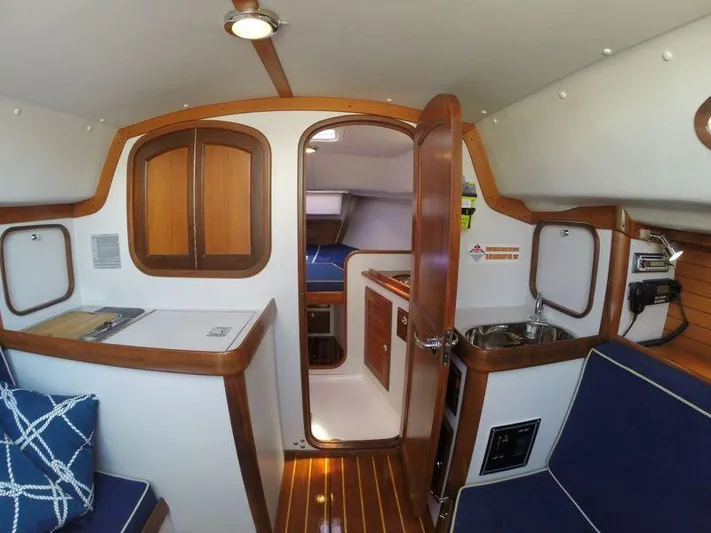 Ohana Lll Yacht Photos Pics Interior of a 2009 Alerion Express 33 sailboat, featuring wood accents and compact design.