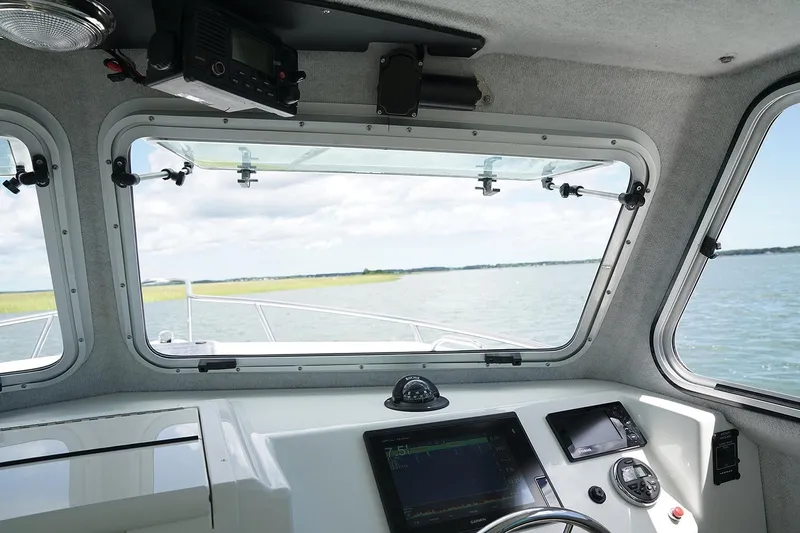  Yacht Photos Pics Manufacturer Provided Image: Interior view of 2019 Parker 2520 XL Sport Cabin boat with navigation equipment.