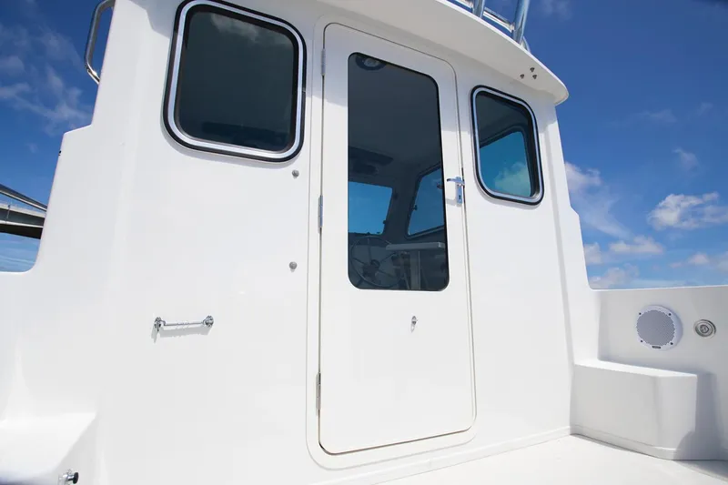  Yacht Photos Pics Manufacturer Provided Image: 2019 Parker 2520 XL Sport Cabin boat exterior with door and windows.