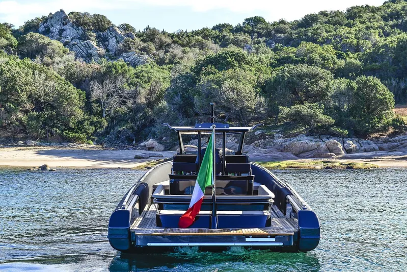 Black Shiver 120 Efb Yacht Photos Pics Novamarine Black Shiver 120 Diesel 2025 boat near a scenic, rocky shoreline.