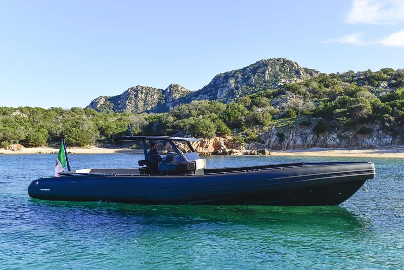 Black Shiver 120 Efb Yacht Photos Pics 2025 Novamarine Black Shiver 120 Diesel boat on clear water with scenic mountain backdrop.