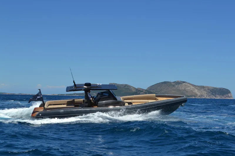 Black Shiver 120 Efb Yacht Photos Pics Novamarine Black Shiver 120 Diesel 2025 cruising on blue ocean near rocky islands.