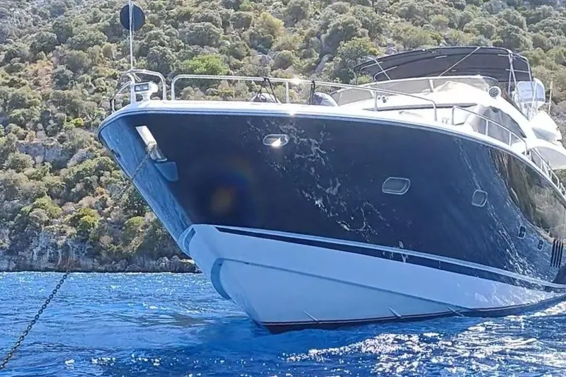  Yacht Photos Pics 2004 Sunseeker 82 Yacht on blue water, scenic background.