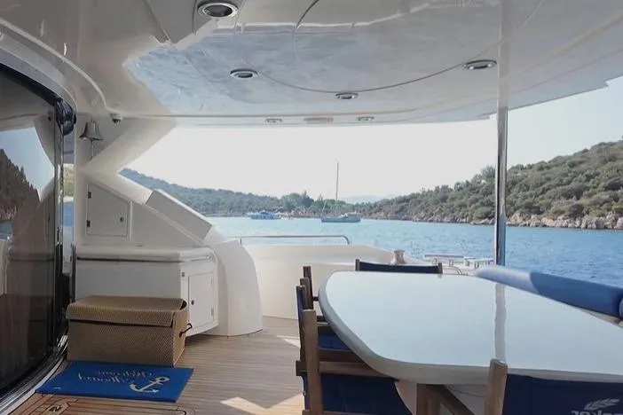  Yacht Photos Pics Luxurious 2004 Sunseeker 82 Yacht deck with scenic ocean view.