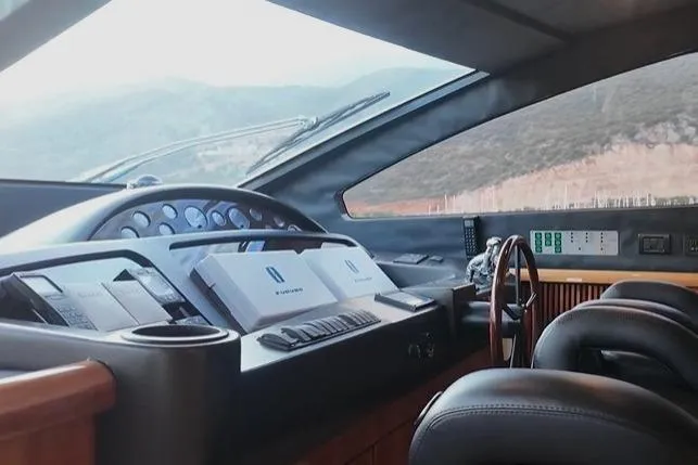  Yacht Photos Pics Interior view of 2004 Sunseeker 82 Yacht helm with modern controls and panoramic windows.