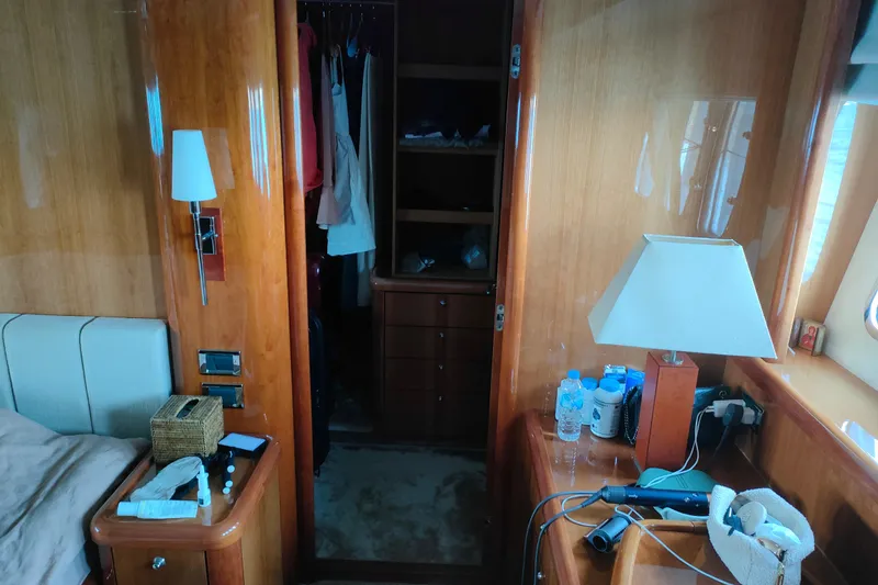  Yacht Photos Pics Luxurious cabin interior of a 2004 Sunseeker 82 Yacht with wooden furnishings.