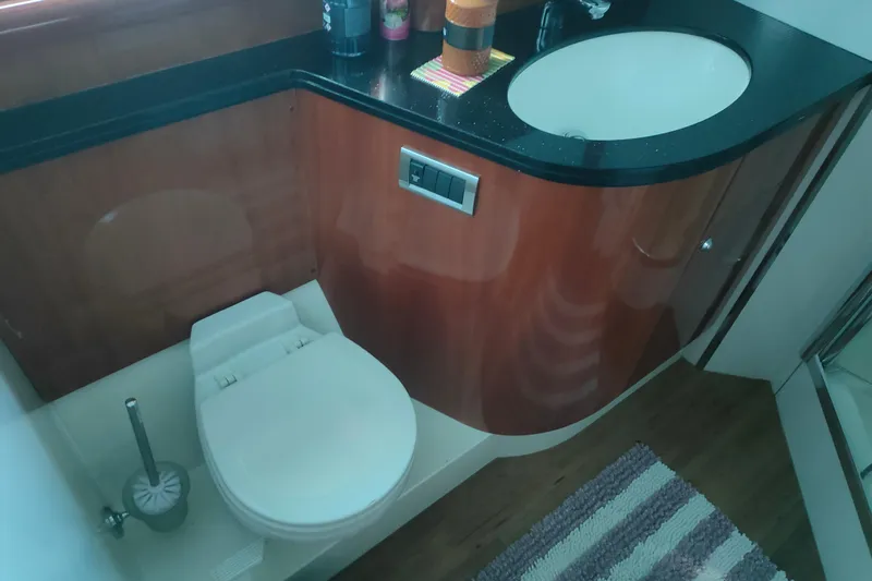  Yacht Photos Pics Luxurious bathroom in 2004 Sunseeker 82 Yacht with modern sink and toilet.