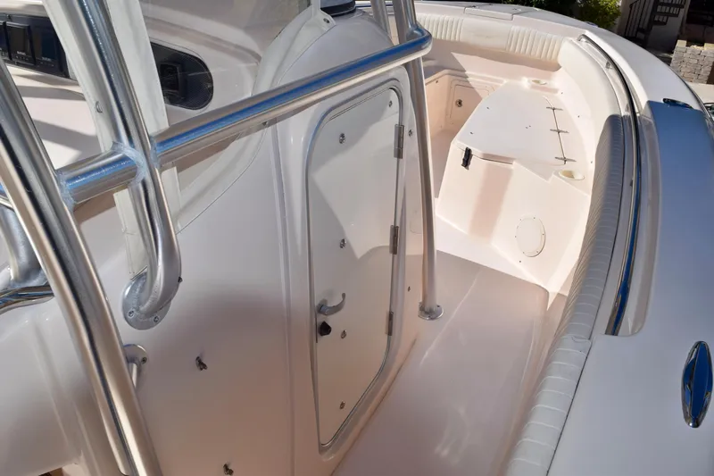  Yacht Photos Pics 2006 Grady-White Bimini 306 boat interior with stainless steel railings and seating area.