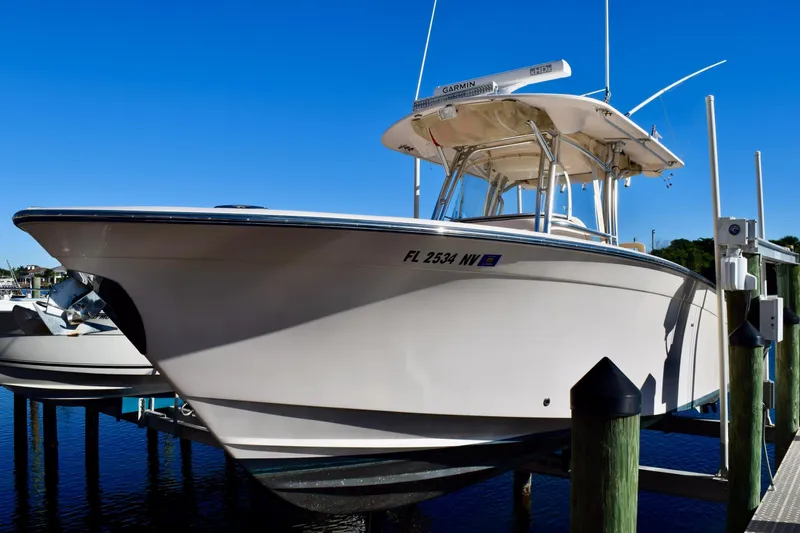  Yacht Photos Pics 2006 Grady-White Bimini 306 boat docked under clear blue sky.