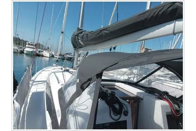  Yacht Photos Pics 2022 Jeanneau Sun Odyssey 410 sailboat docked in a marina.