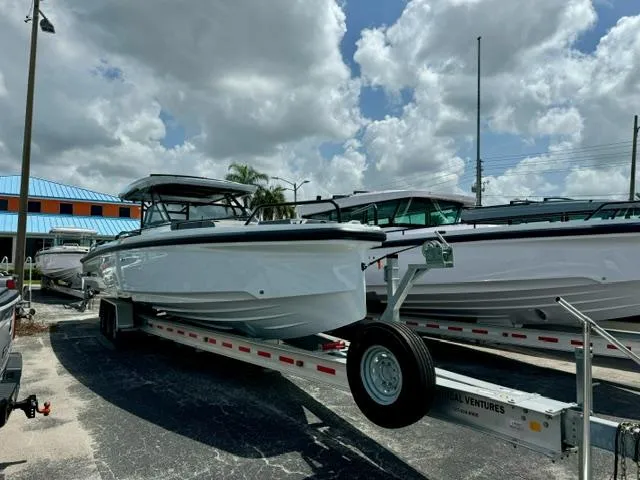 2024 BRABUS Shadow 1000 ST boat on trailer under cloudy sky.