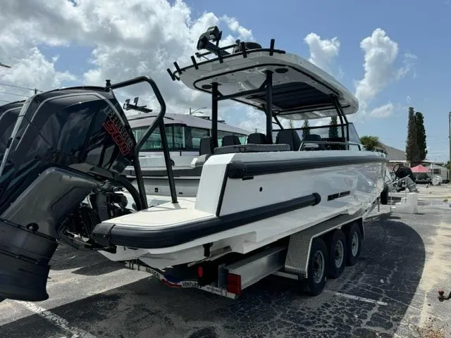 2024 BRABUS Shadow 1000 ST boat on trailer, rear view, sunny day.