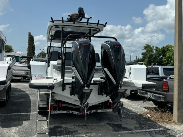 2024 BRABUS Shadow 1000 ST boat with dual engines, parked outdoors.