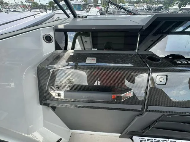  Yacht Photos Pics 2024 BRABUS Shadow 1000 ST dashboard with sleek carbon fiber finish and modern controls.