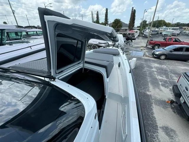  Yacht Photos Pics 2024 BRABUS Shadow 1000 ST luxury boat with open cabin, docked in a marina.