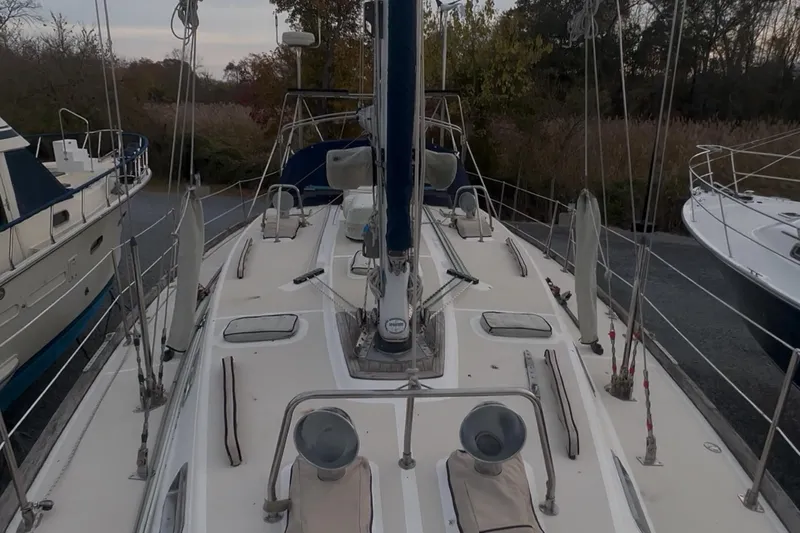 Braveheart Yacht Photos Pics Sailboat deck of a 1999 Tartan 4600, docked with surrounding boats.