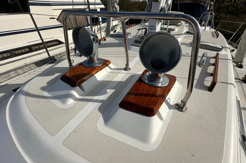 Braveheart Yacht Photos Pics Deck of 1999 Tartan 4600 sailboat with chrome vents and wooden accents.