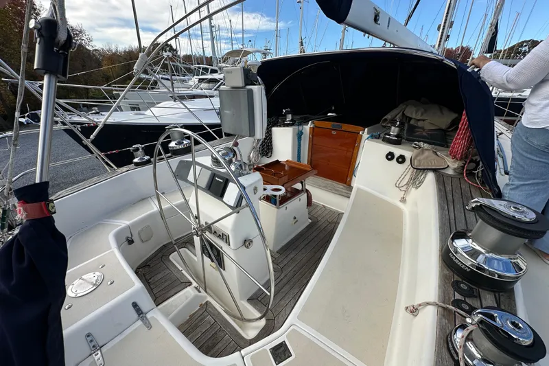 Braveheart Yacht Photos Pics Cockpit of a 1999 Tartan 4600 sailboat with steering wheel and winches.