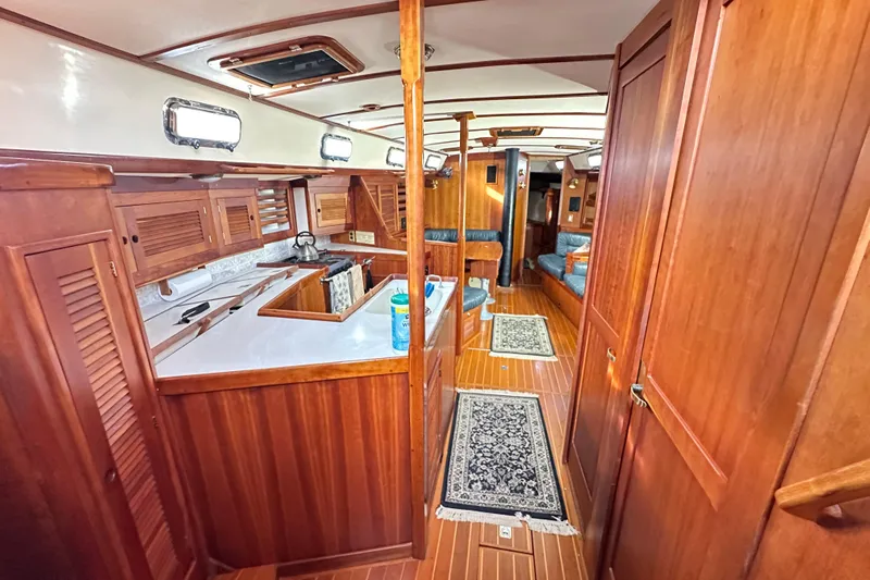 Braveheart Yacht Photos Pics Luxurious 1999 Tartan 4600 yacht interior with wooden cabinetry and elegant design.