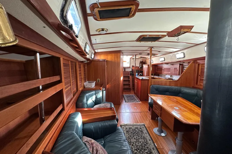 Braveheart Yacht Photos Pics Luxurious 1999 Tartan 4600 yacht interior with wood finish and leather seating.