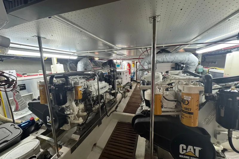 Flyin Low Yacht Photos Pics Engine room of a 2007 DeFever 56 yacht, featuring CAT marine engines.