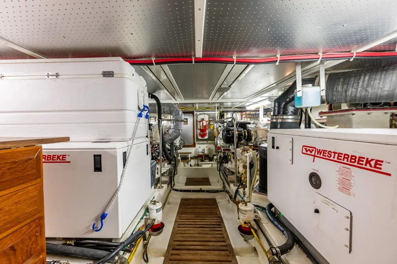 Flyin Low Yacht Photos Pics Engine room of 2007 DeFever 56 yacht with Westerbeke generators and equipment.
