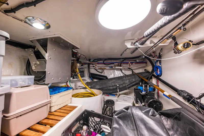 Flyin Low Yacht Photos Pics Engine room of 2007 DeFever 56 yacht, featuring storage and equipment.