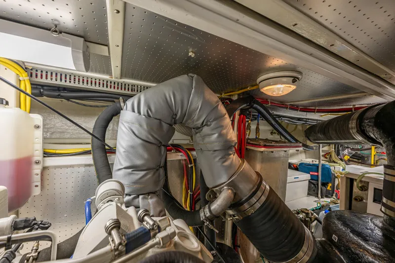 Flyin Low Yacht Photos Pics Engine room of 2007 DeFever 56 yacht with insulated pipes and wiring.