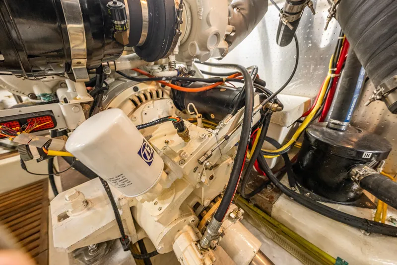 Flyin Low Yacht Photos Pics Engine room of 2007 DeFever 56 yacht, showcasing mechanical components and wiring.
