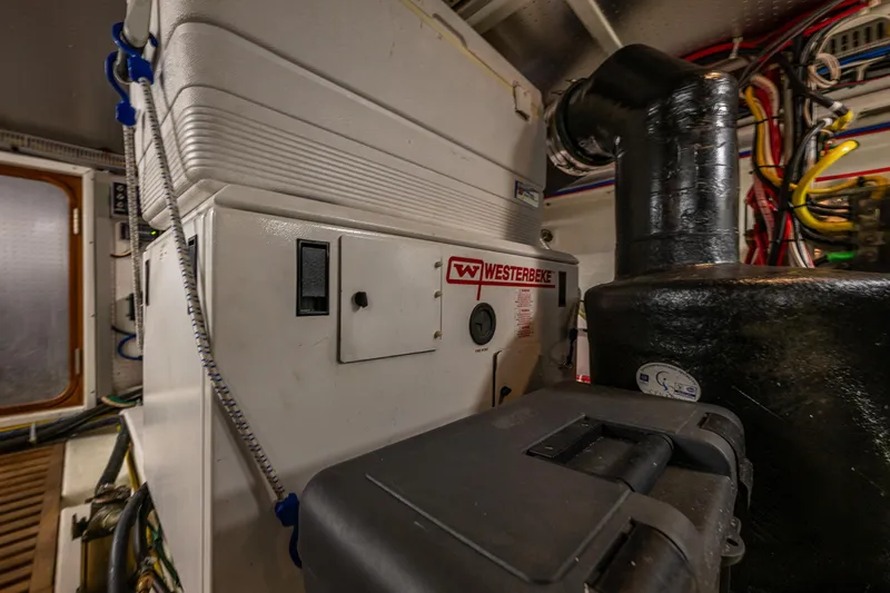 Flyin Low Yacht Photos Pics Engine room of 2007 DeFever 56 yacht with Westerbeke generator and wiring.