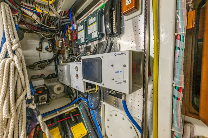 Flyin Low Yacht Photos Pics Engine room of 2007 DeFever 56 yacht with control panels and wiring.