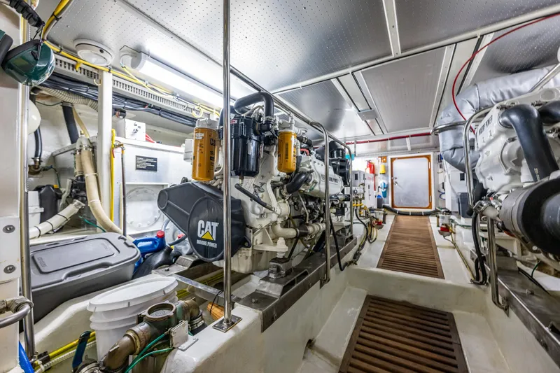 Flyin Low Yacht Photos Pics Engine room of 2007 DeFever 56 yacht, featuring CAT marine power engines.