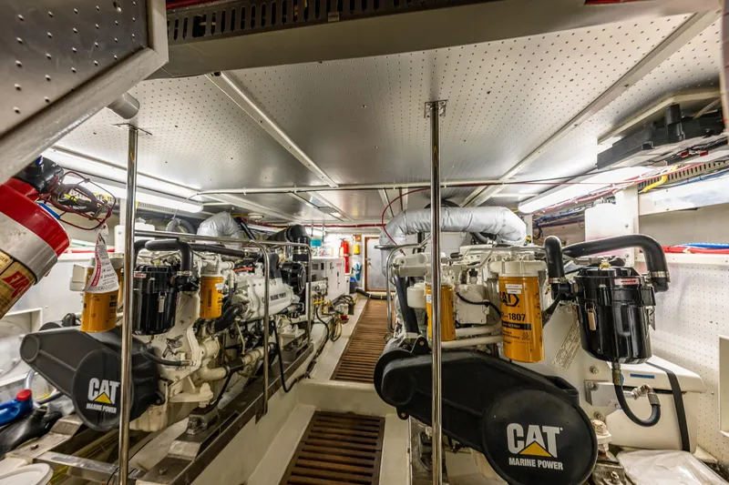 Flyin Low Yacht Photos Pics Engine room of 2007 DeFever 56 yacht with CAT Marine Power engines.