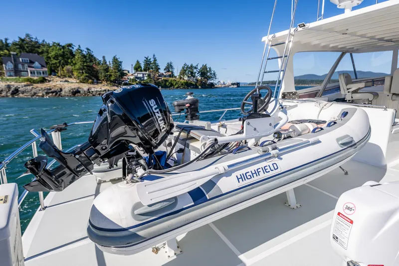 Flyin Low Yacht Photos Pics A 2007 DeFever 56 yacht with a Highfield inflatable boat and Suzuki outboard motor.