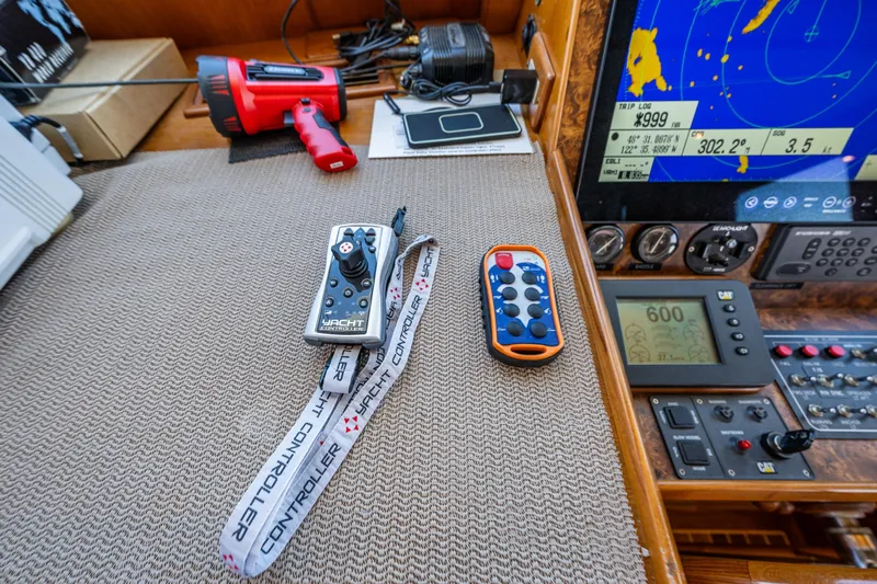 Flyin Low Yacht Photos Pics Yacht control panel with remote controllers on a 2007 DeFever 56.