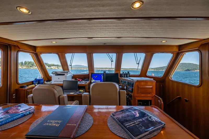 Flyin Low Yacht Photos Pics Pilothouse interior of 2007 DeFever 56 yacht with panoramic windows and navigation equipment.