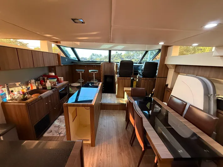  Yacht Photos Pics Luxurious interior of 2007 Fairline Squadron 68 yacht with modern kitchen and dining area.