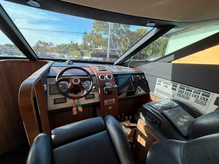  Yacht Photos Pics Interior helm of 2007 Fairline Squadron 68 yacht with steering wheel and control panels.