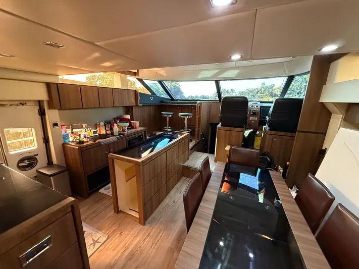  Yacht Photos Pics Luxurious interior of 2007 Fairline Squadron 68 yacht with modern kitchen and dining area.