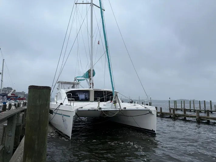 White Wings Yacht Photos Pics Leopard 48 catamaran docked on a cloudy day, 2013 model.