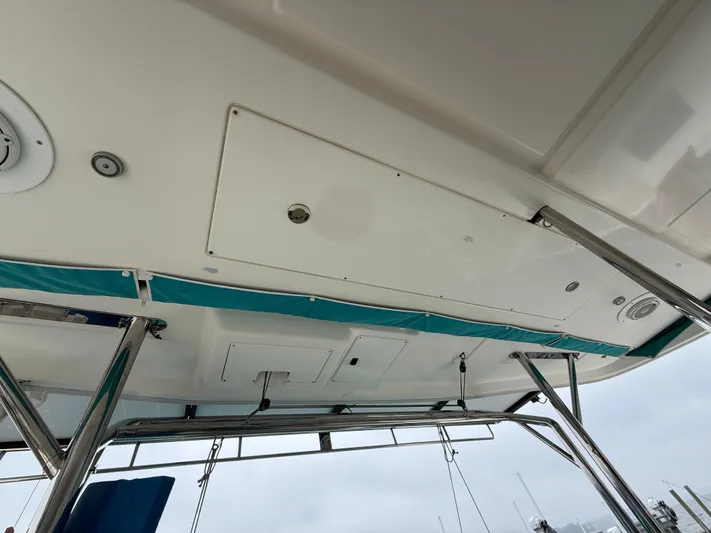 White Wings Yacht Photos Pics Leopard 48 yacht ceiling view with metal supports and teal accents, 2013 model.