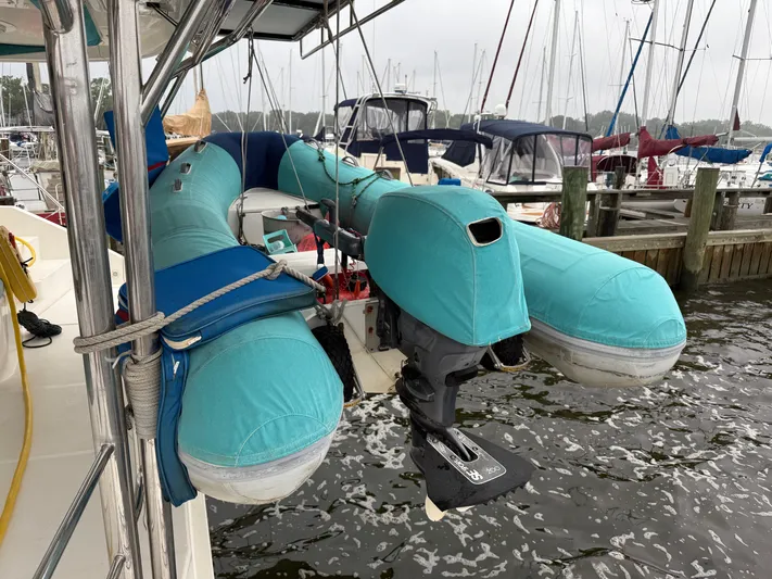 White Wings Yacht Photos Pics Inflatable boat with motor cover on Leopard 48 yacht, docked at marina, 2013 model.